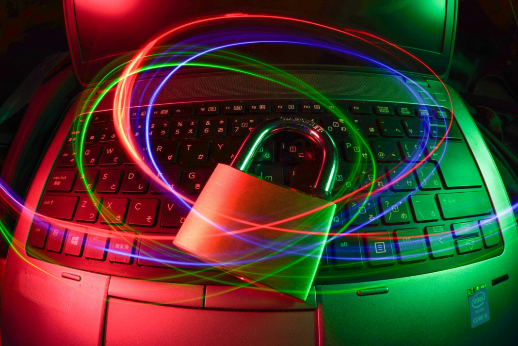 padlock on laptop with lightrails