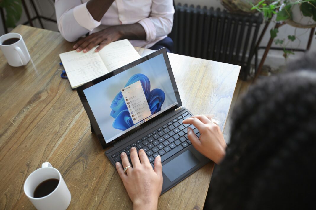 woman typing on a laptop