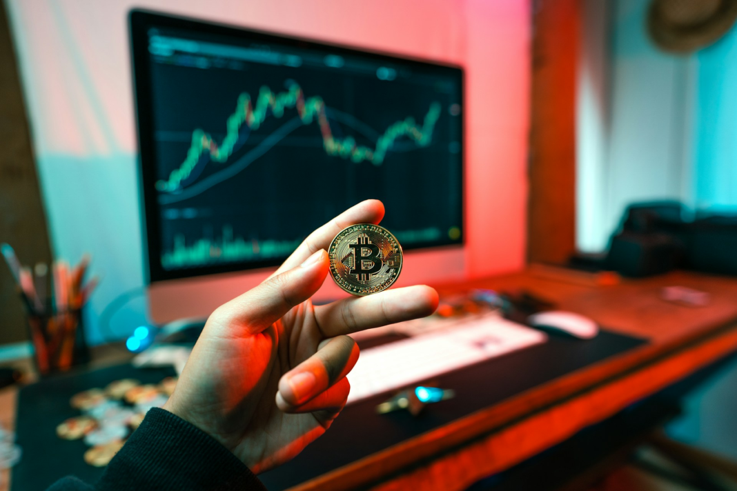 hand holding a crypto coin