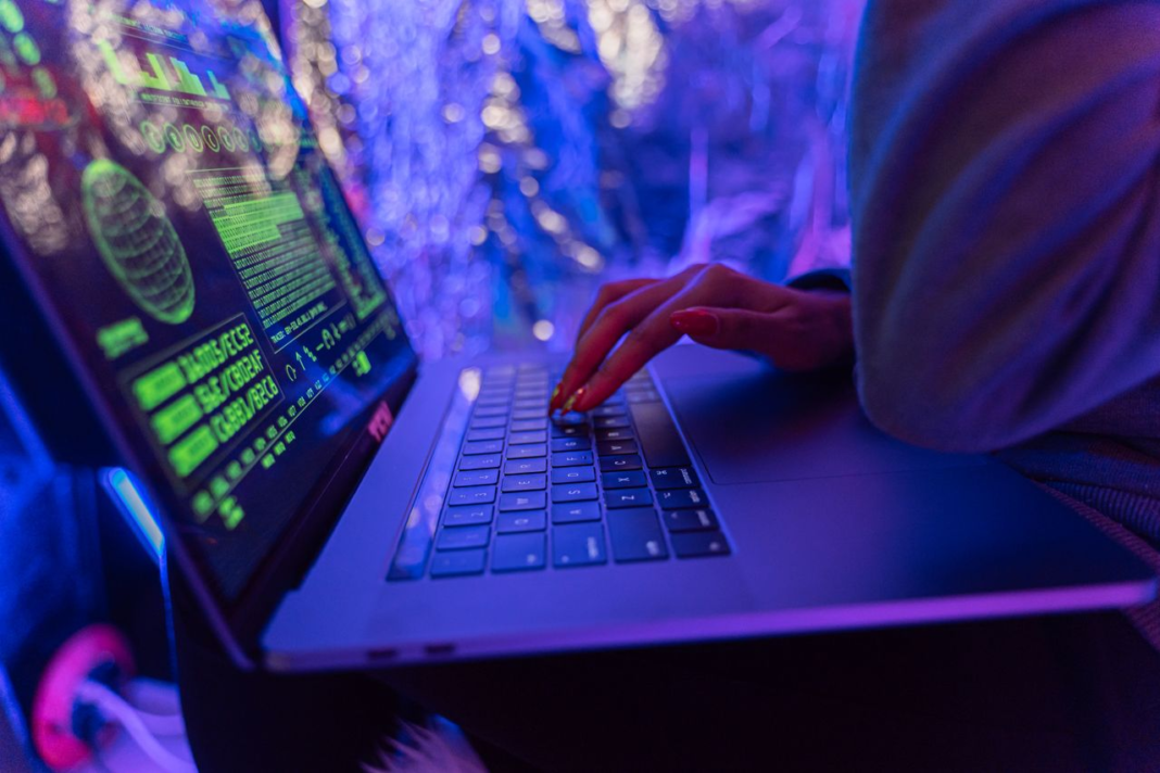 person typing on a laptop